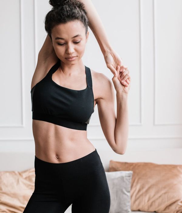 Athlete in a focused yoga stretch pose, enhancing flexibility.